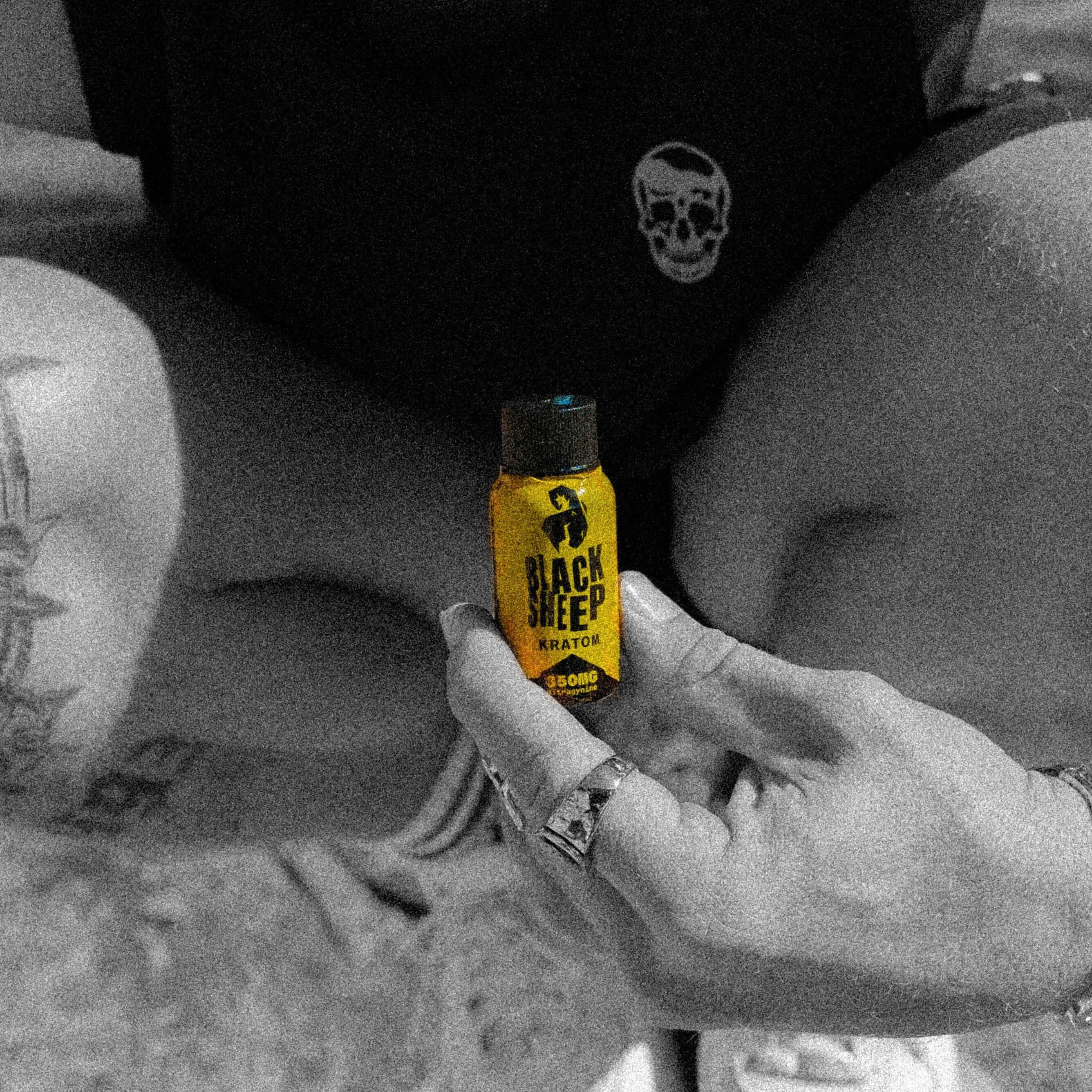 kratom shot held in hands