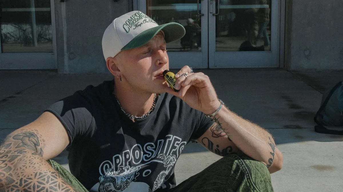 man sipping a kratom shot