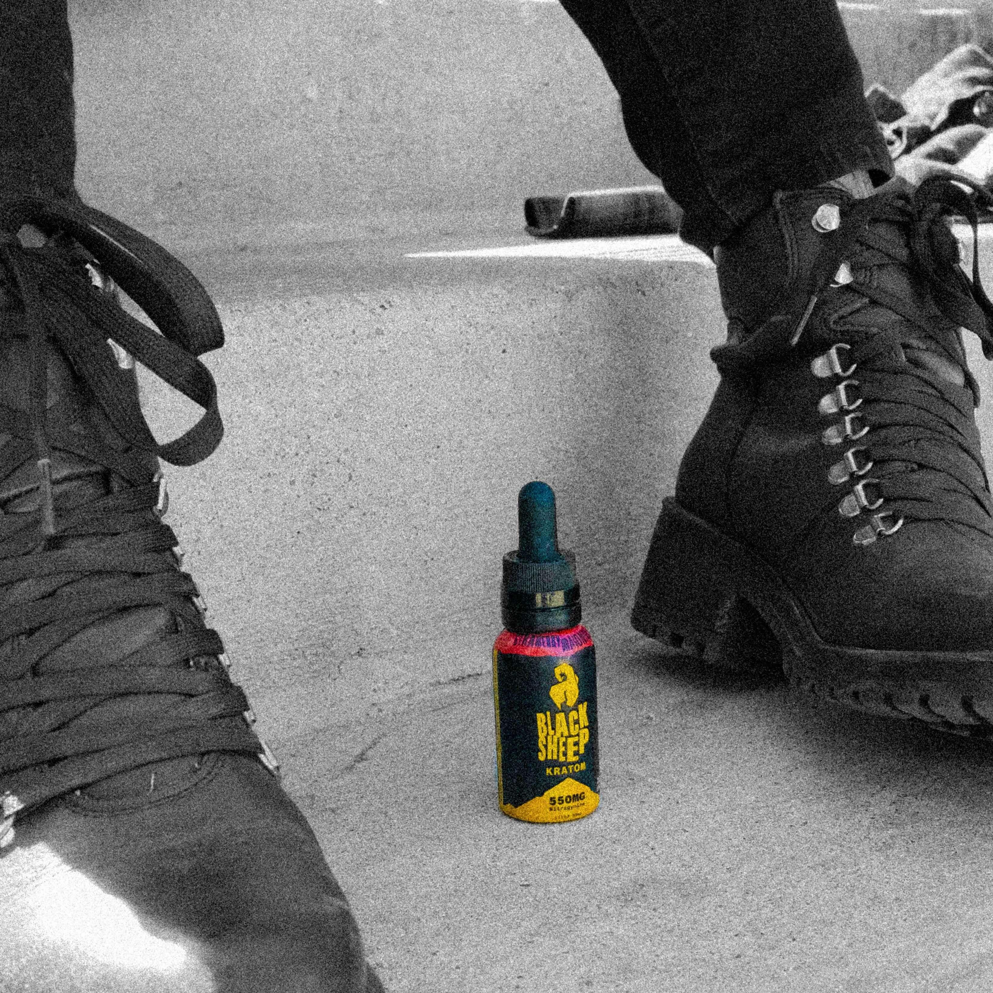kratom tincture next to boots