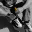 man holding kratom shot on skateboard