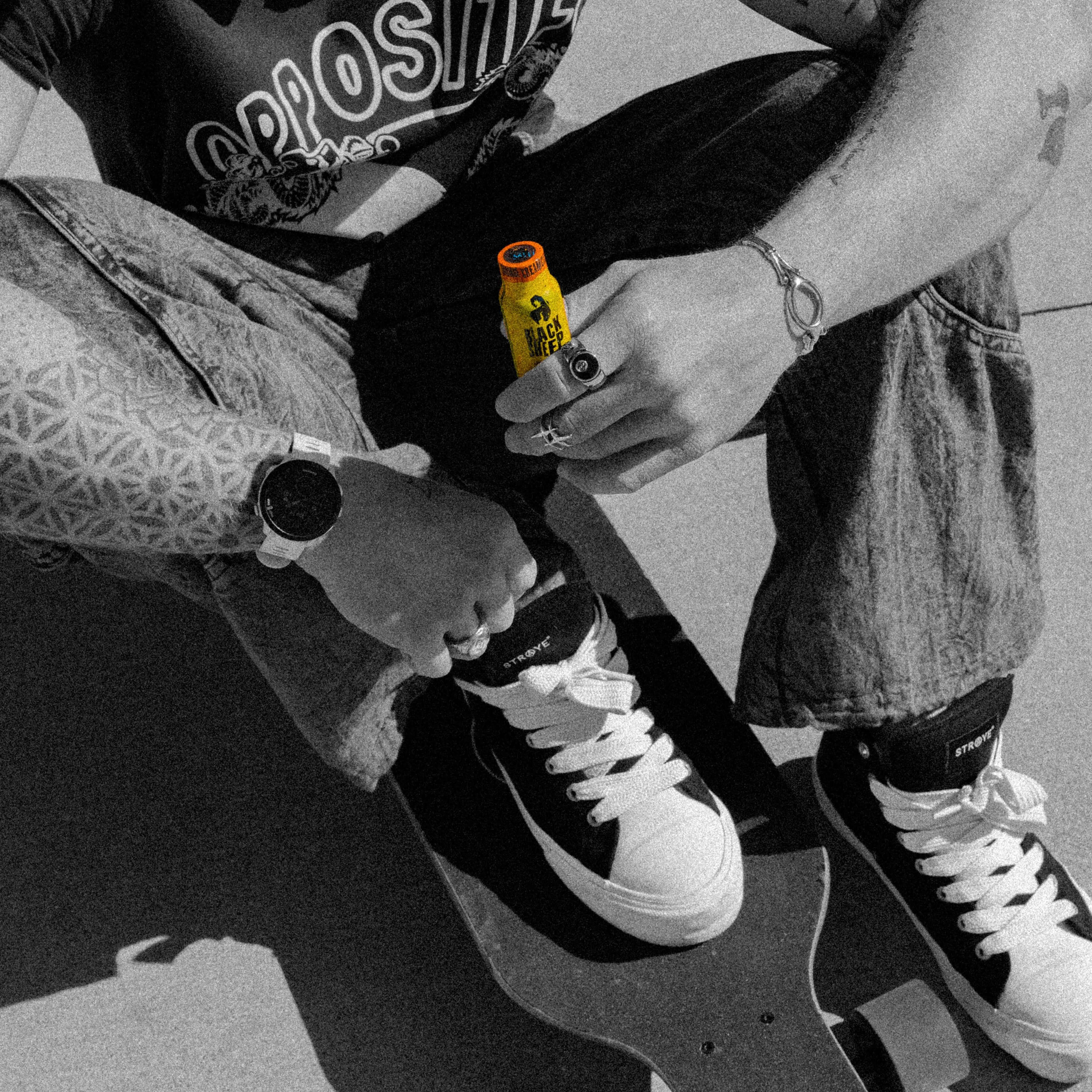 man holding kratom shot on skateboard