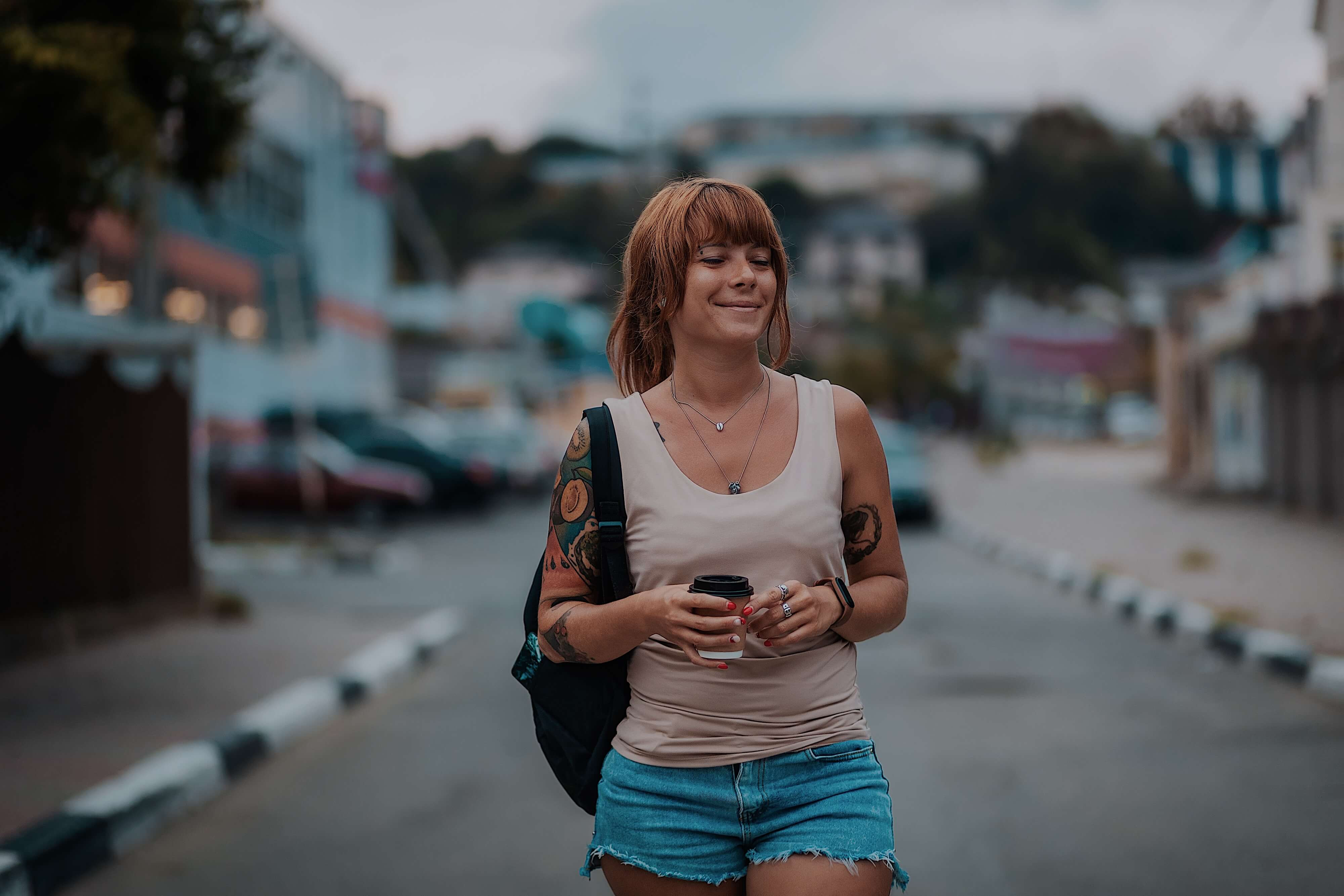 woman walking with coffee
